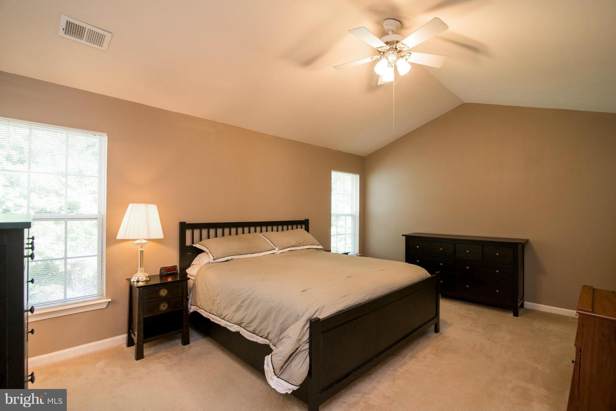 3044 Shoreline Boulevard Laurel, MD 20724 - Photo 6 of 13 a bedroom with a bed and a window