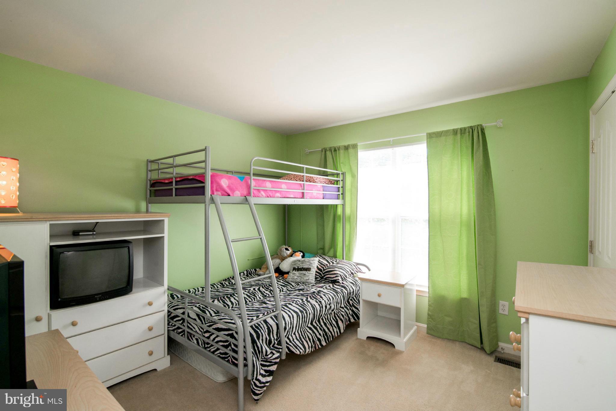 3044 Shoreline Boulevard Laurel, MD 20724 - Photo 8 of 13 a bed room with a bed and a television