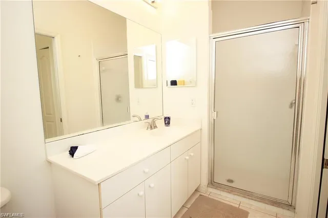 a bathroom with a sink and a shower