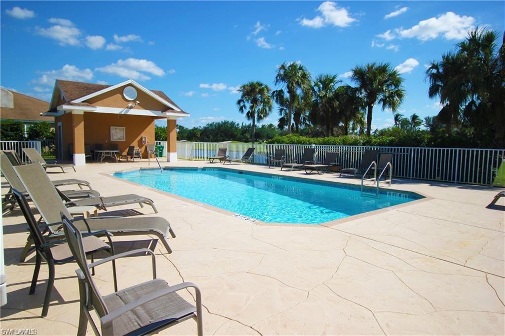 1736 Morning Sun Lane, Unit D6 Naples, FL 34119 - Photo 16 of 29 a view of a house with swimming pool and sitting area