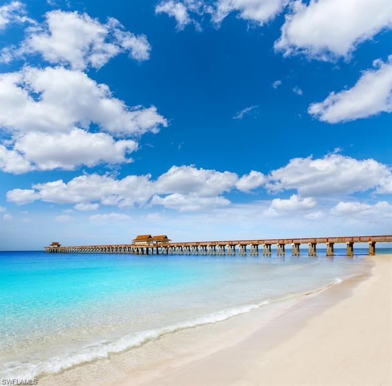 1736 Morning Sun Lane, Unit D6 Naples, FL 34119 - Photo 26 of 29 a view of swimming pool and mountain