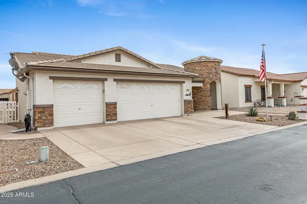 a front view of a house with a garage