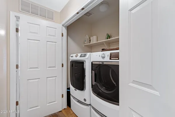 a utility room with dryer and washer
