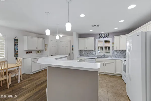 a kitchen with counter top space cabinets and stainless steel appliances