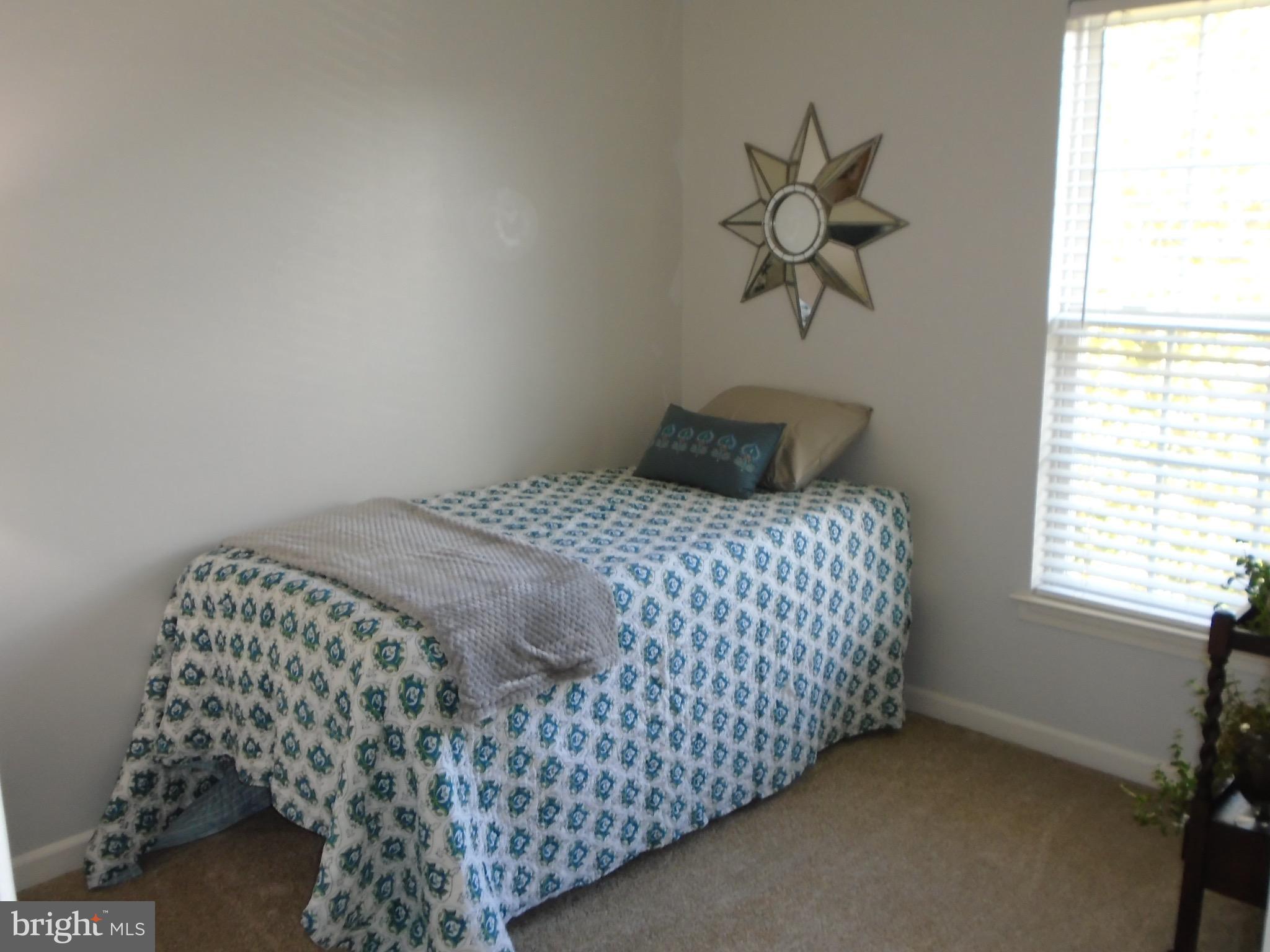 1243 Steed Street Ranson, WV 25438 - Photo 22 of 29 a bedroom with a bed and window