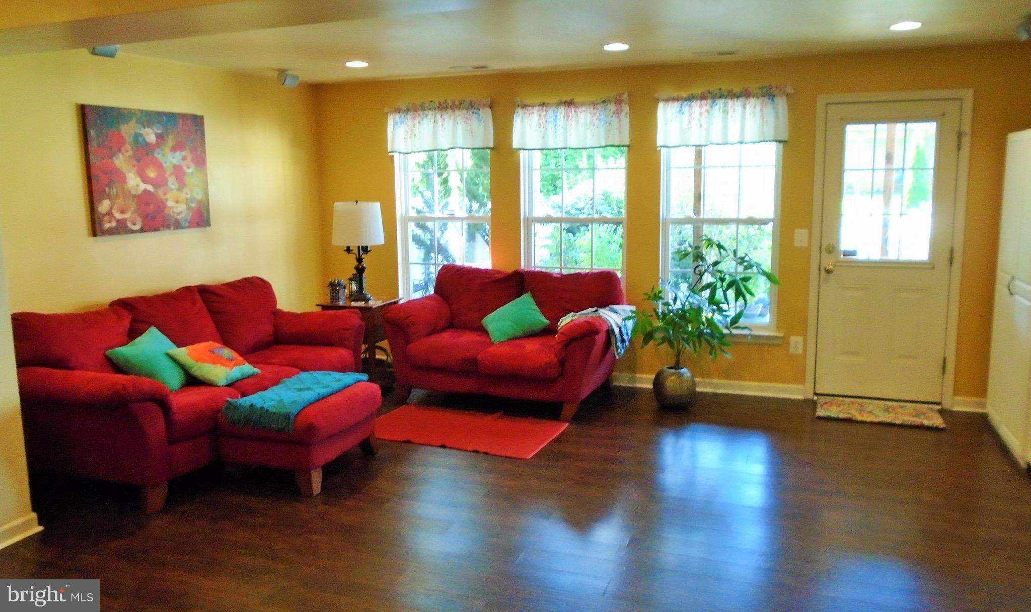 1243 Steed Street Ranson, WV 25438 - Photo 6 of 29 a living room with furniture and a large window