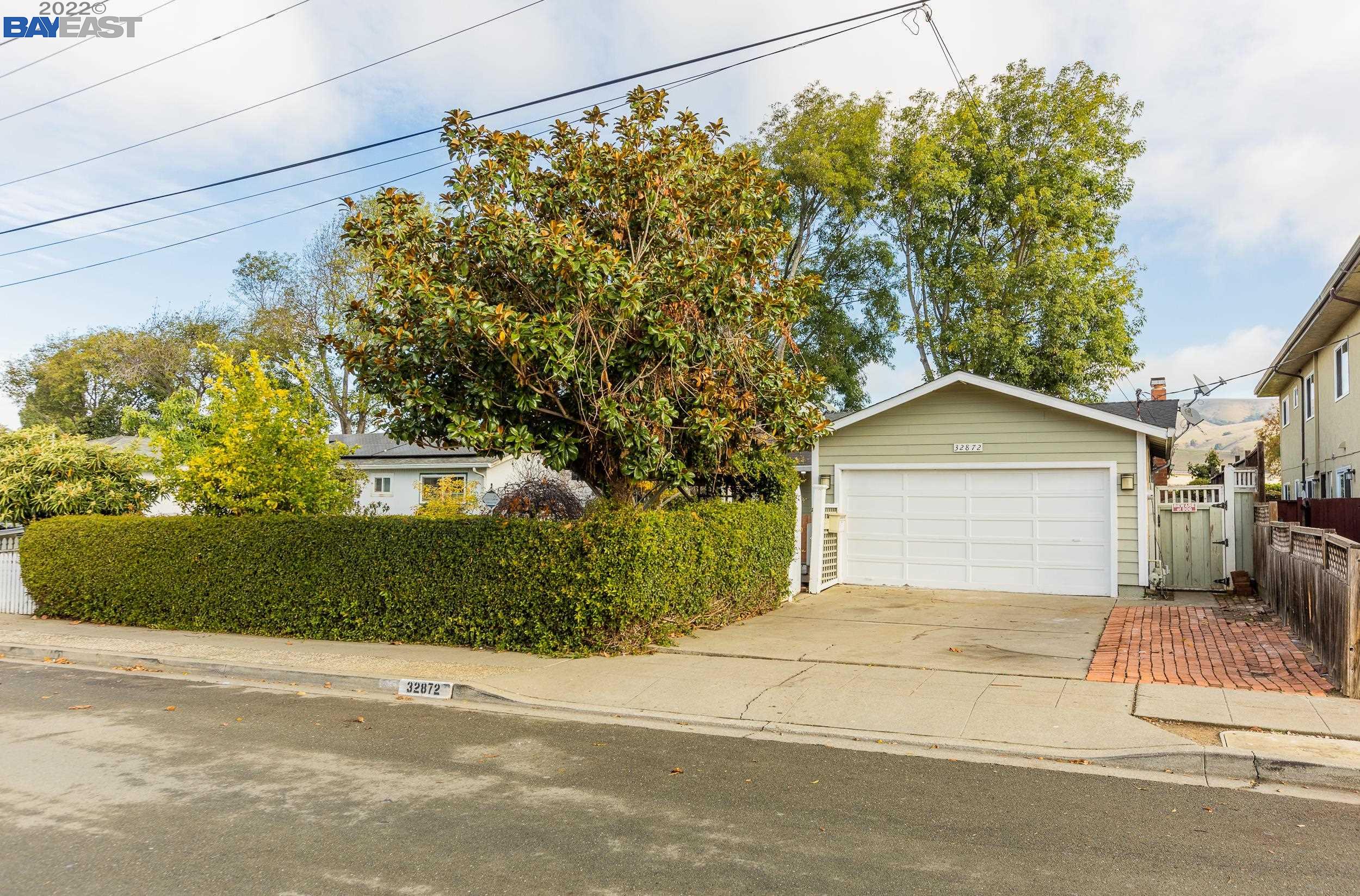 32872 Ithaca Street Union City, CA 94587 - Photo 1 of 1 a front view of a house with a yard and garage