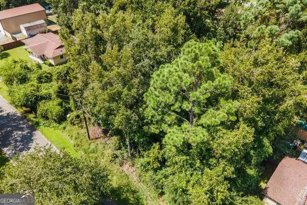 a view of a house with a tree