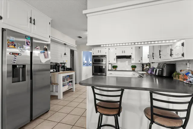 a view of a living room and dining room