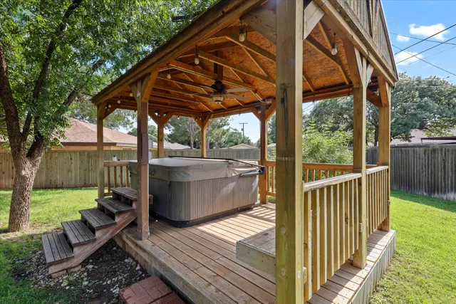 a view of a house with a yard and sitting area