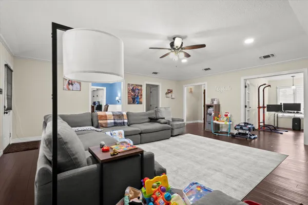 a living room with furniture fireplace and a flat screen tv