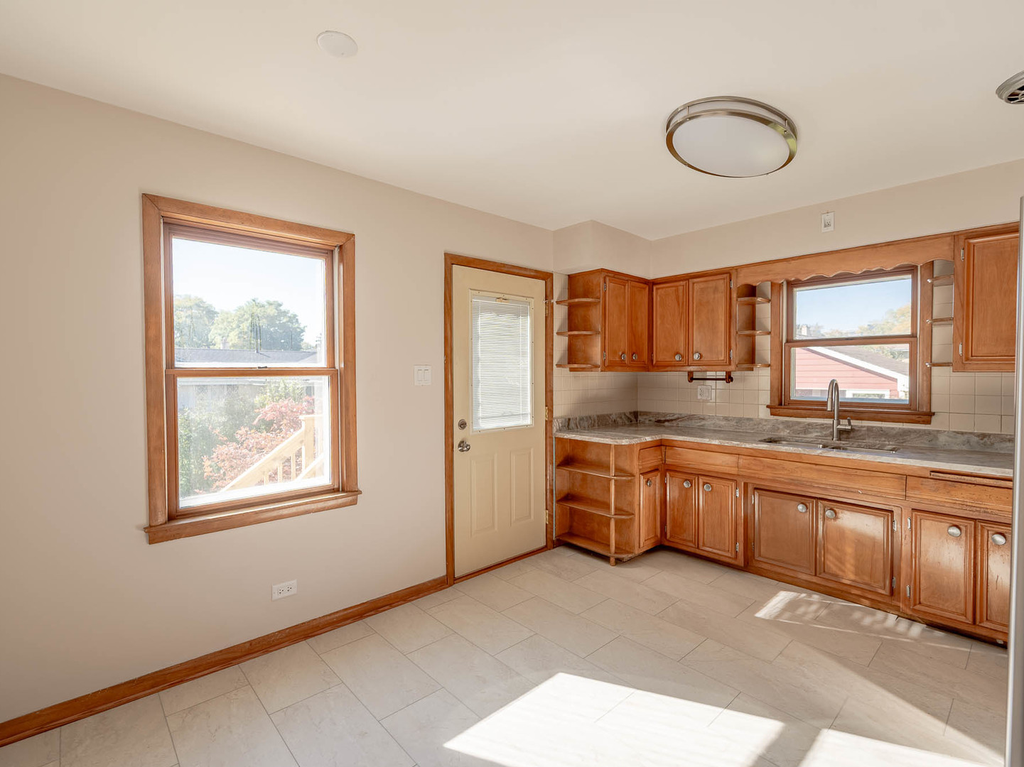 2228 High Ridge Parkway Hillside, IL 60162 - Photo 3 of 16 a large kitchen with stainless steel appliances granite countertop a large window