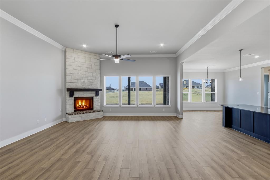 812 Vly Rdg Road Van Alstyne, TX 75495 - Photo 5 of 33 a view of an empty room with a fireplace and a window