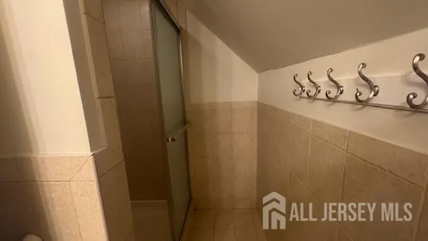 a bathroom with a toilet a sink and bathtub