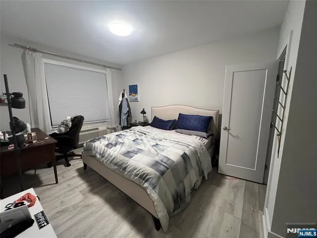 a bathroom with a sink mirror and a toilet