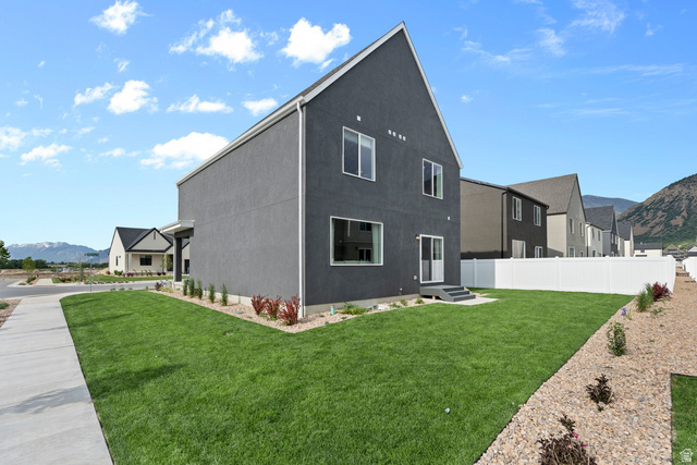 722 West 2840 South, Unit 8 Logan, UT 84321 - Photo 6 of 23 Rear view of house with a mountain view and stucco siding