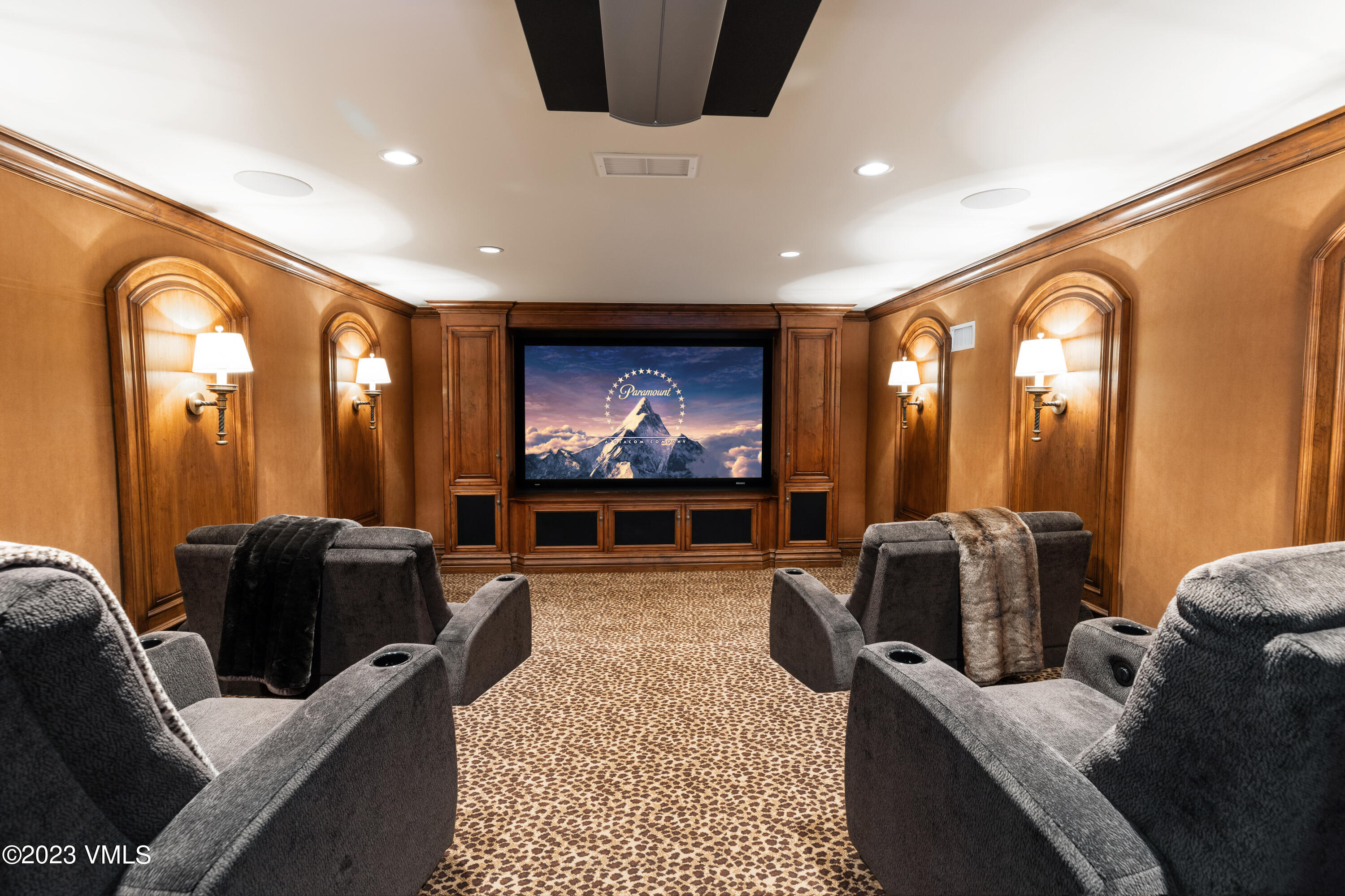 155 Arrowhead Drive Edwards, CO 81632 - Photo 15 of 45 a living room with furniture a projector and a flat screen tv