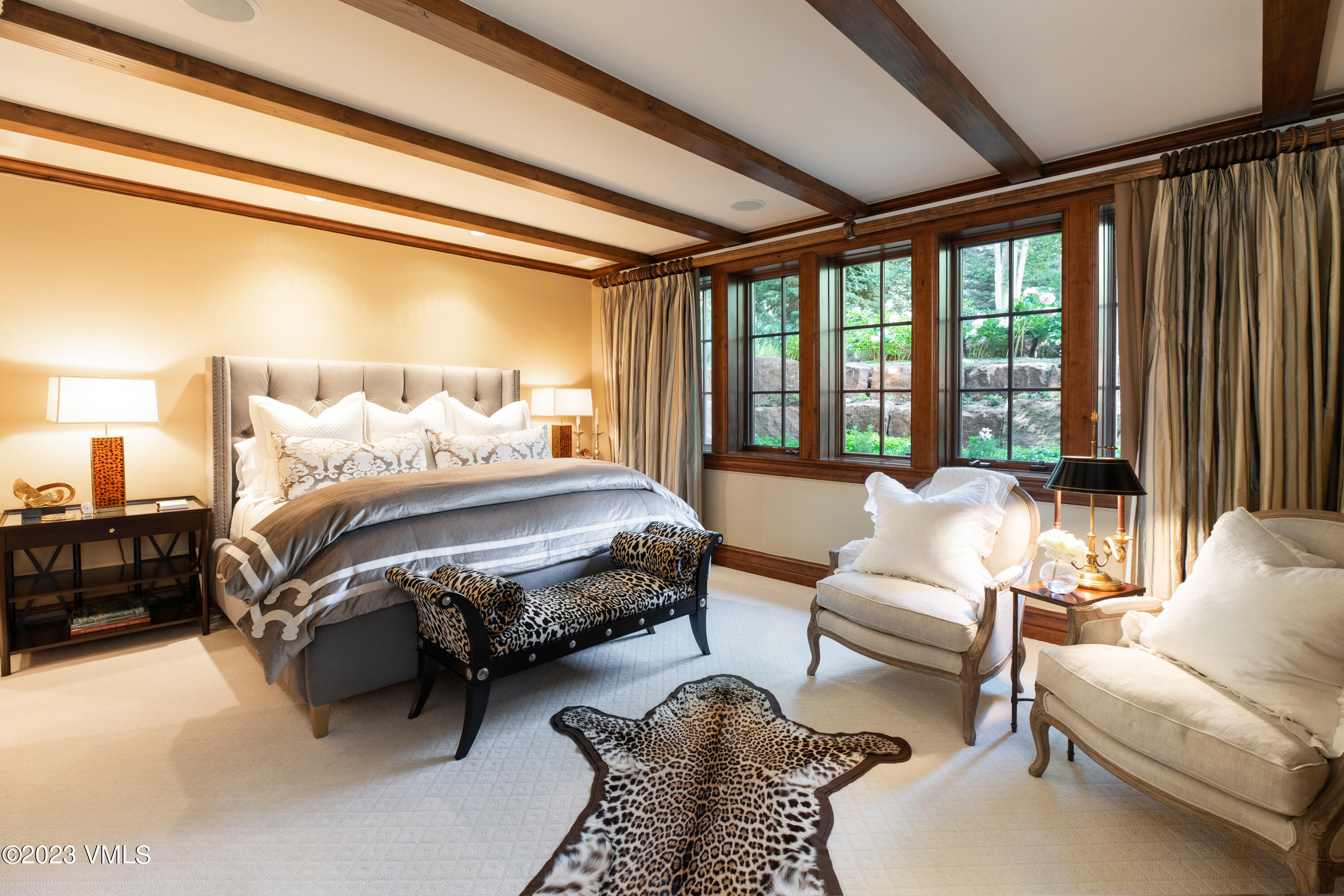 155 Arrowhead Drive Edwards, CO 81632 - Photo 22 of 45 a bedroom with furniture and a large window