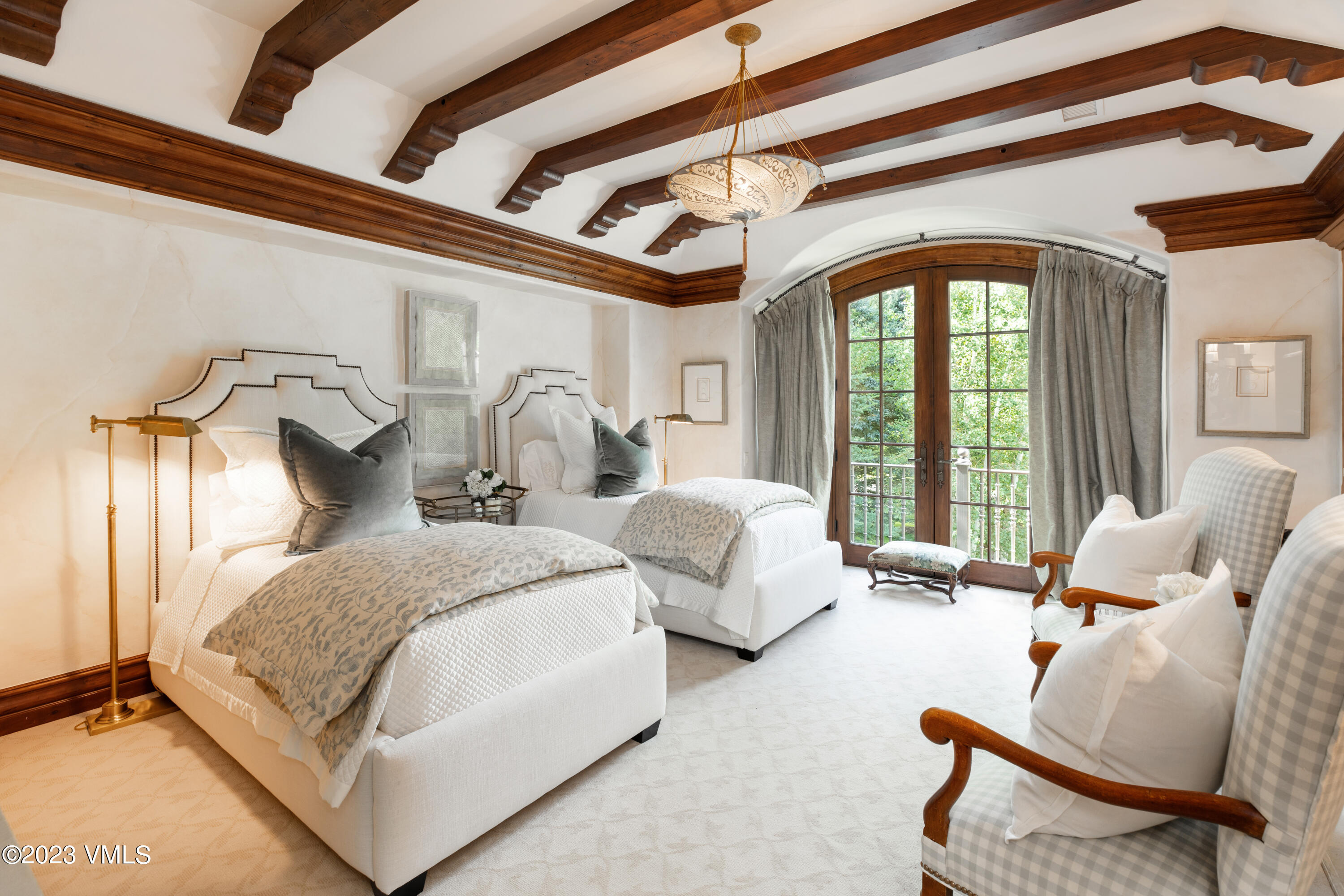 155 Arrowhead Drive Edwards, CO 81632 - Photo 23 of 45 a spacious bedroom with two beds and large windows