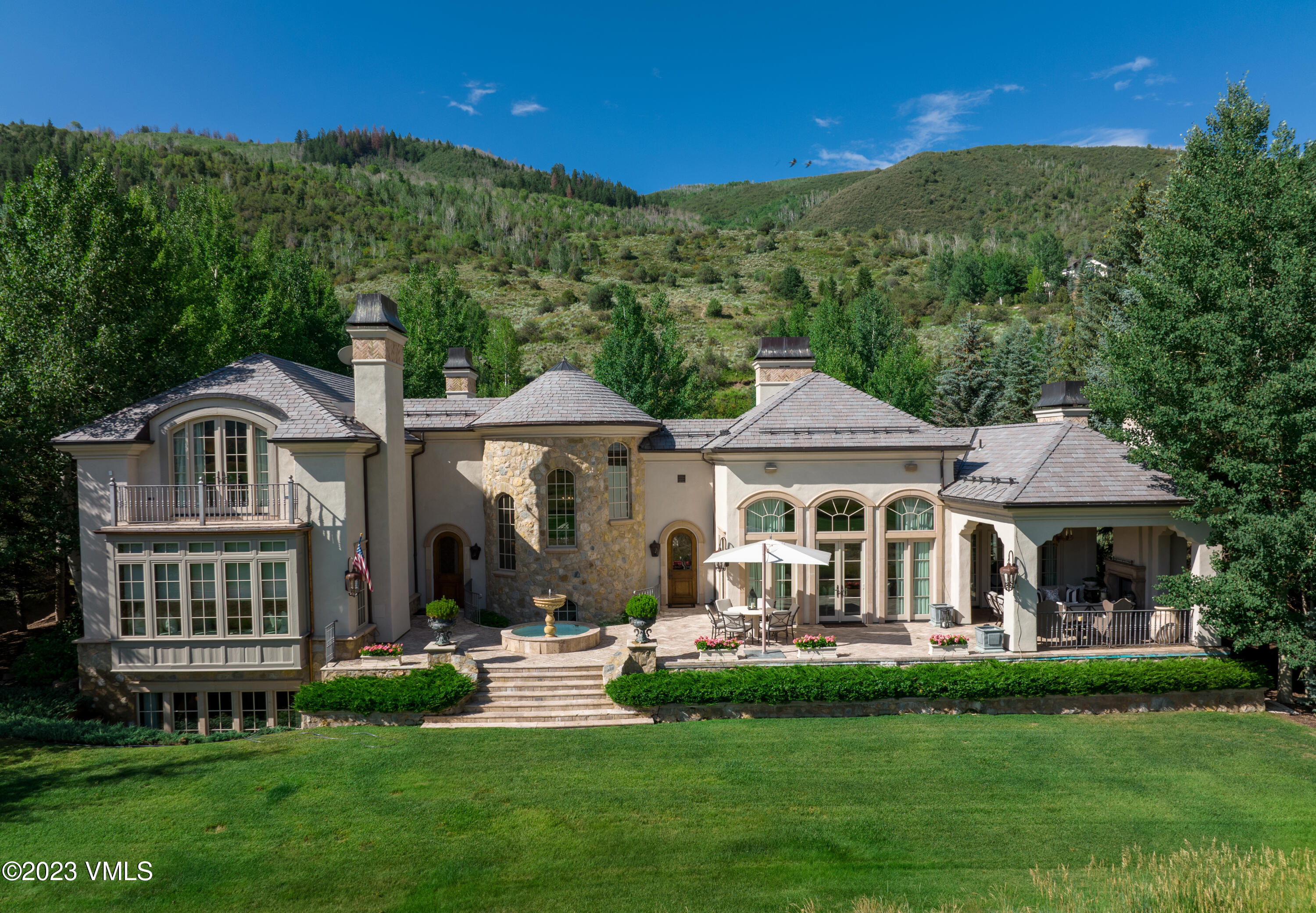155 Arrowhead Drive Edwards, CO 81632 - Photo 33 of 45 a front view of a house with a yard table and chairs