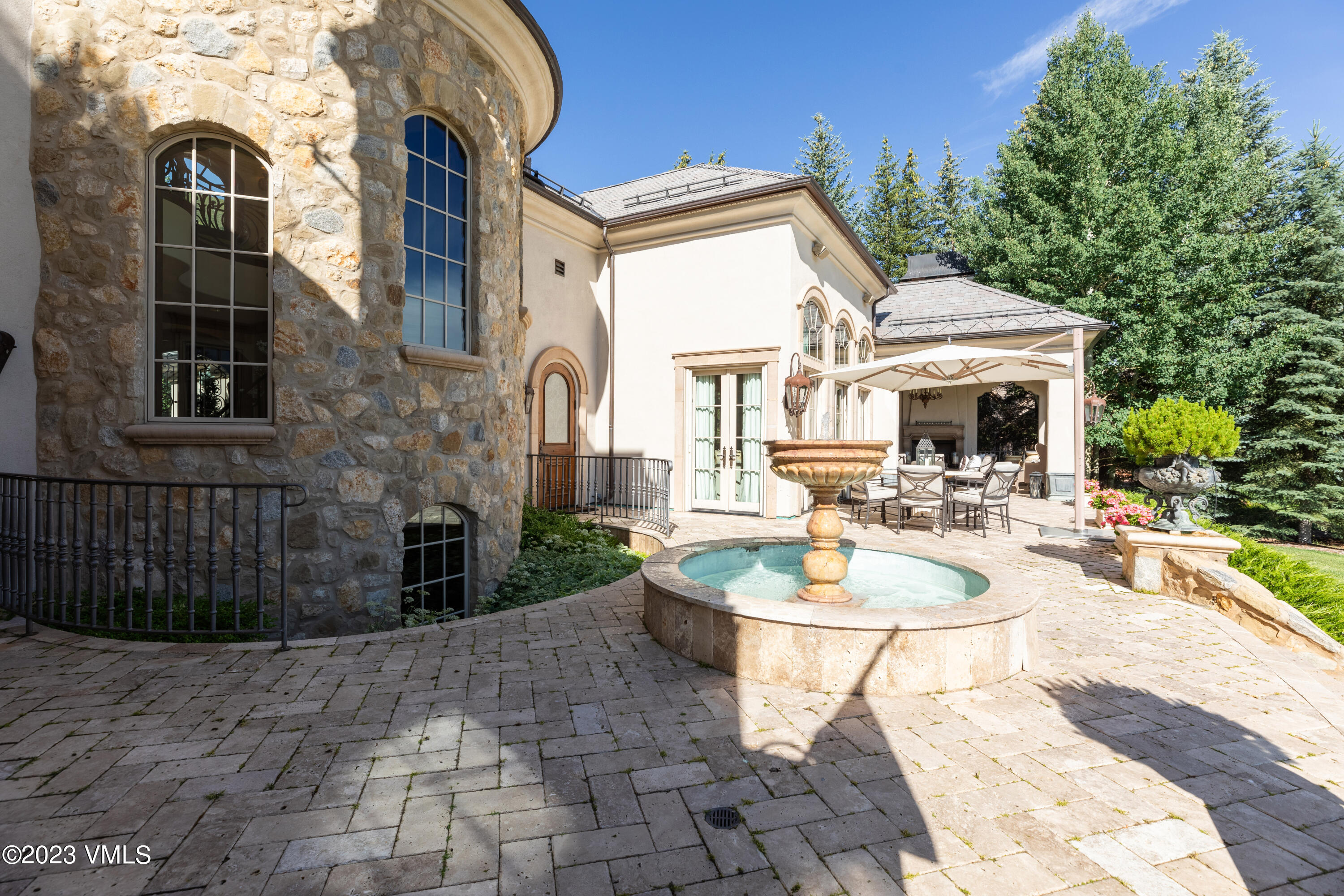 155 Arrowhead Drive Edwards, CO 81632 - Photo 39 of 45 a view of a patio with couches a table and chairs and potted plants