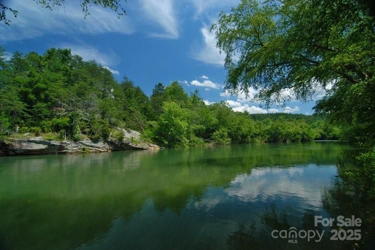 2482 Paddock Circle Morganton, NC 28655 - Photo 4 of 13 a view of a lake with a big yard