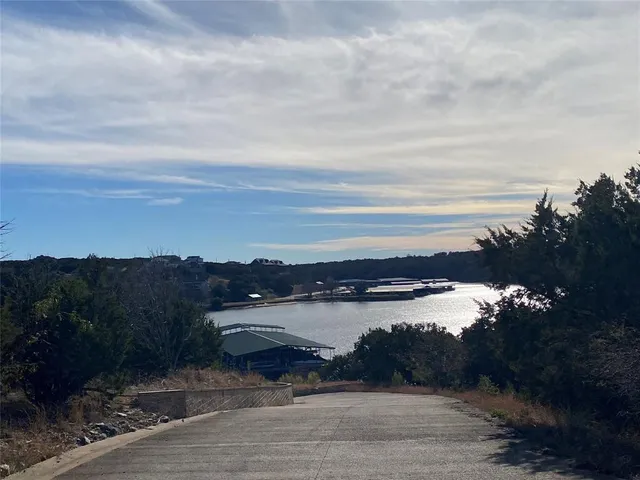 a view of a lake with houses in the back