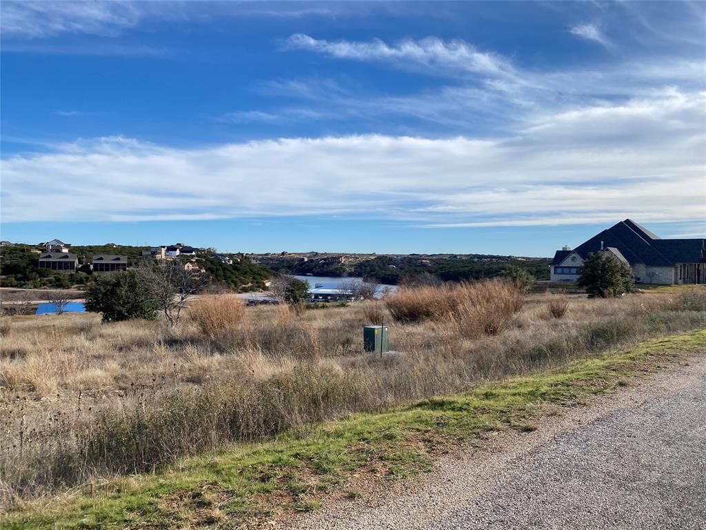 Tbd Rawhide Ridge Graford, TX 76449 - Photo 7 of 12 a view of a lake with a yard