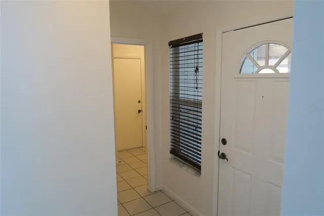 a lobby with furniture and a large window