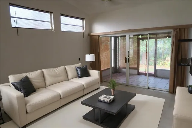 a view of a livingroom with furniture and window