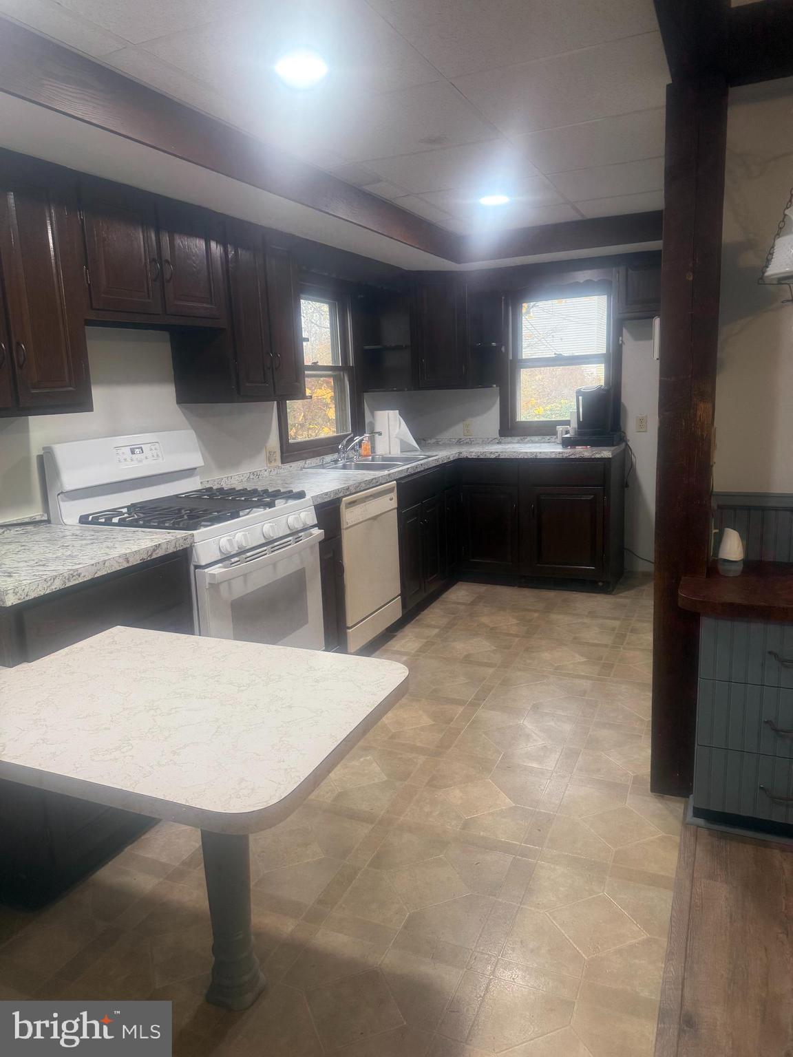 246 South Spruce Street Lititz, PA 17543 - Photo 4 of 6 a kitchen with stainless steel appliances kitchen island granite countertop a sink and cabinets