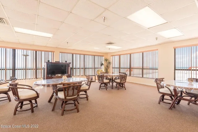 a view of a work space with furniture and a window