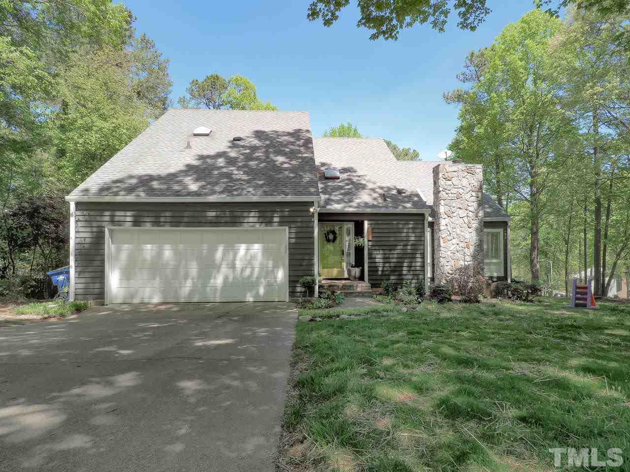 2012 Fawndale Drive Raleigh, NC 27612 - Photo 1 of 27 a front view of a house with a garden
