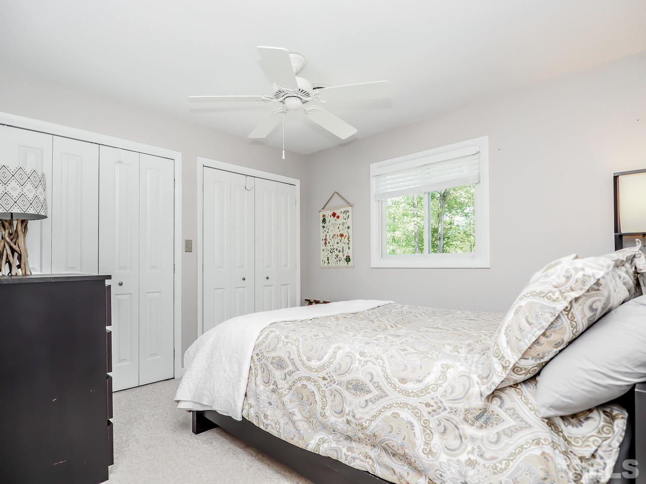 2012 Fawndale Drive Raleigh, NC 27612 - Photo 16 of 27 a bedroom with a large bed and a window