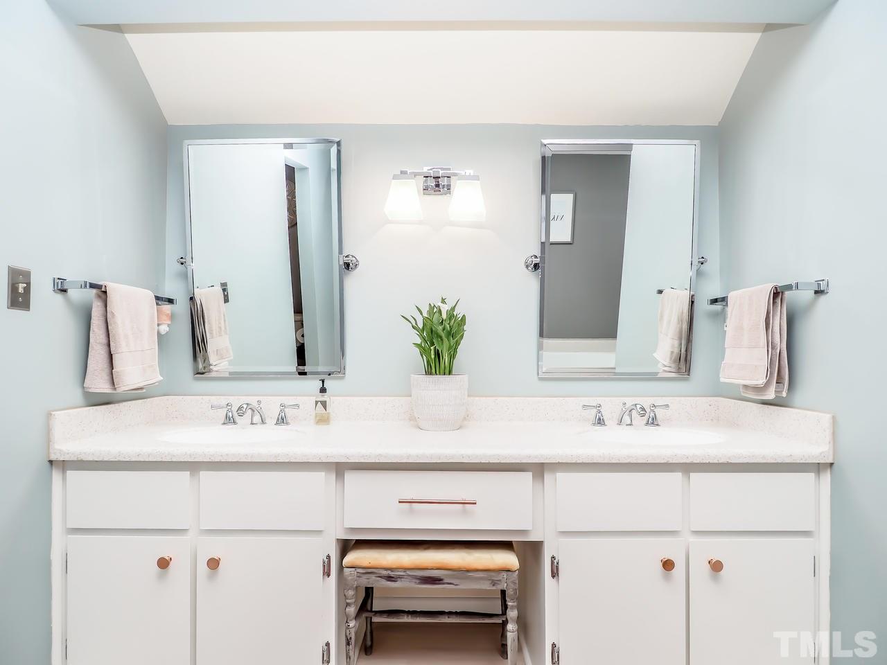 2012 Fawndale Drive Raleigh, NC 27612 - Photo 20 of 27 a view with sink and mirror