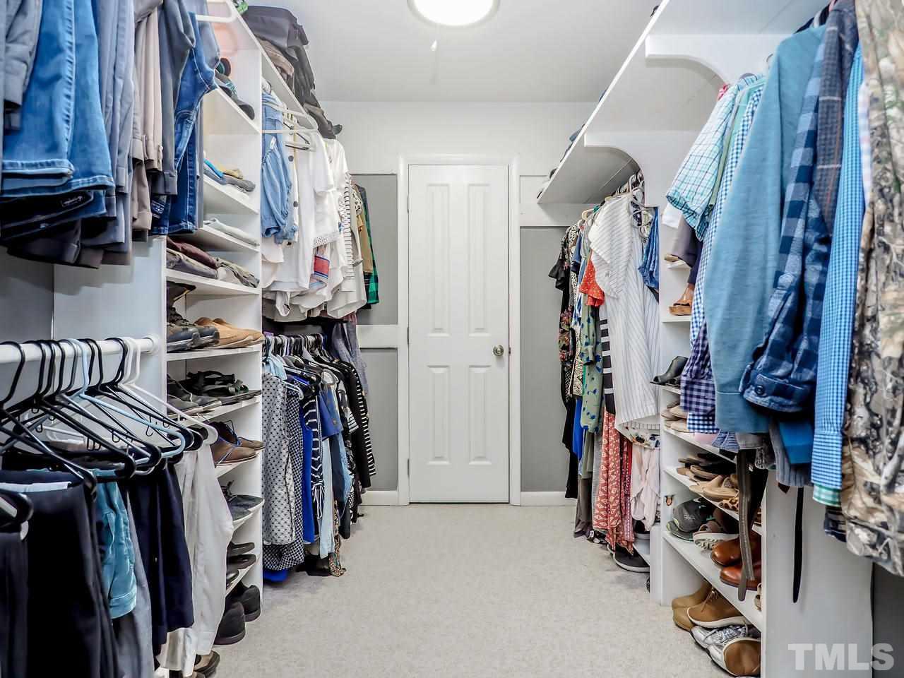2012 Fawndale Drive Raleigh, NC 27612 - Photo 22 of 27 a view of walk in closet with clothes