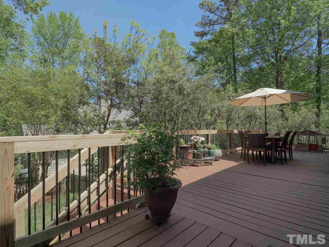 2012 Fawndale Drive Raleigh, NC 27612 - Photo 23 of 27 a view of balcony with outdoor seating and wooden floor