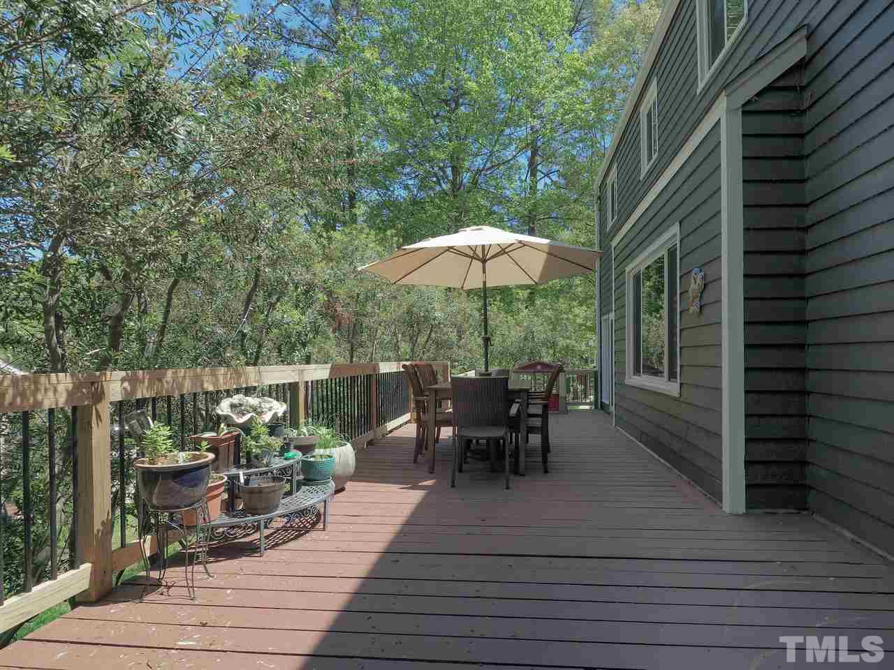 2012 Fawndale Drive Raleigh, NC 27612 - Photo 24 of 27 an outdoor space with furniture and umbrella