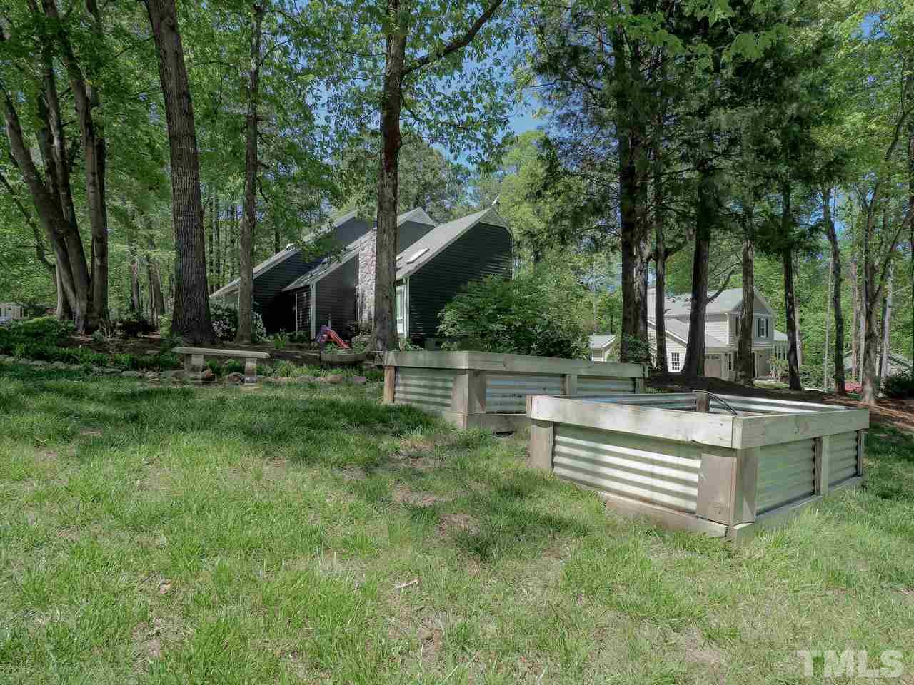 2012 Fawndale Drive Raleigh, NC 27612 - Photo 27 of 27 a view of patio with a table and chairs