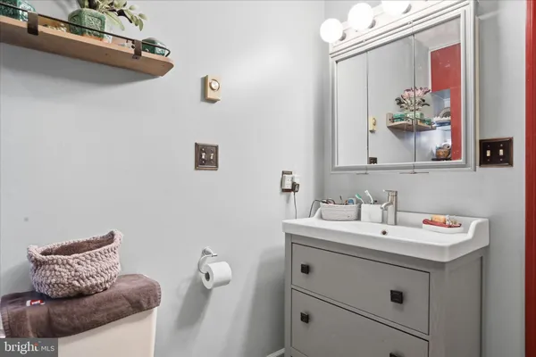 a kitchen that has a lot of cabinets in it and a sink