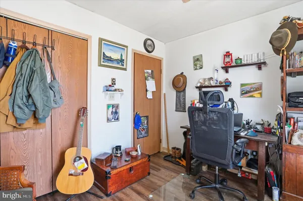 a bedroom with bed and a window