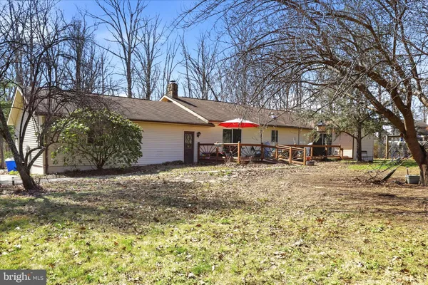 a view of a chairs and table on the wooden floor