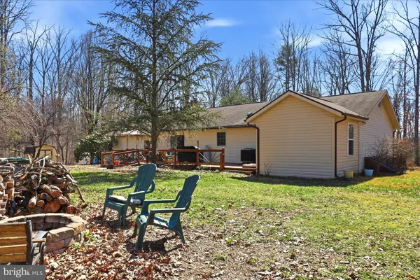 a backyard of a house with seating space