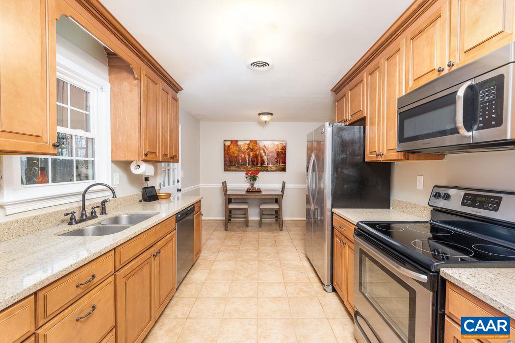 2422 Huntington Road Charlottesville, VA 22901 - Photo 12 of 49 a kitchen with stainless steel appliances a sink dishwasher stove refrigerator and cabinets