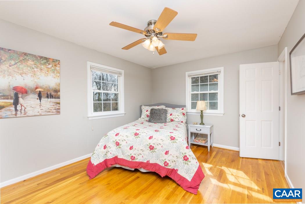 2422 Huntington Road Charlottesville, VA 22901 - Photo 19 of 49 a bedroom with a bed and wooden floor