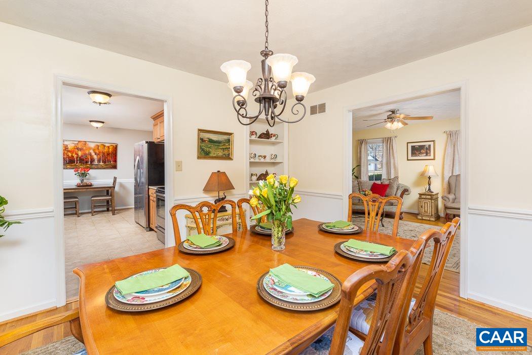 2422 Huntington Road Charlottesville, VA 22901 - Photo 10 of 49 a view of a dining room with furniture a chandelier and wooden floor