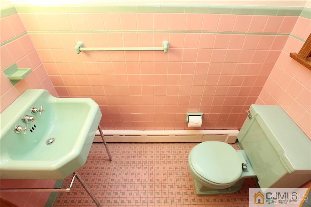 25 Academy Road Somerset, NJ 08873 - Photo 18 of 25 a bathroom with a toilet and a sink