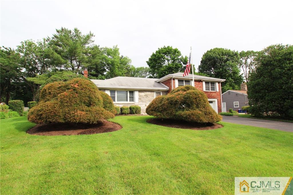 25 Academy Road Somerset, NJ 08873 - Photo 2 of 25 a front view of a house with a garden