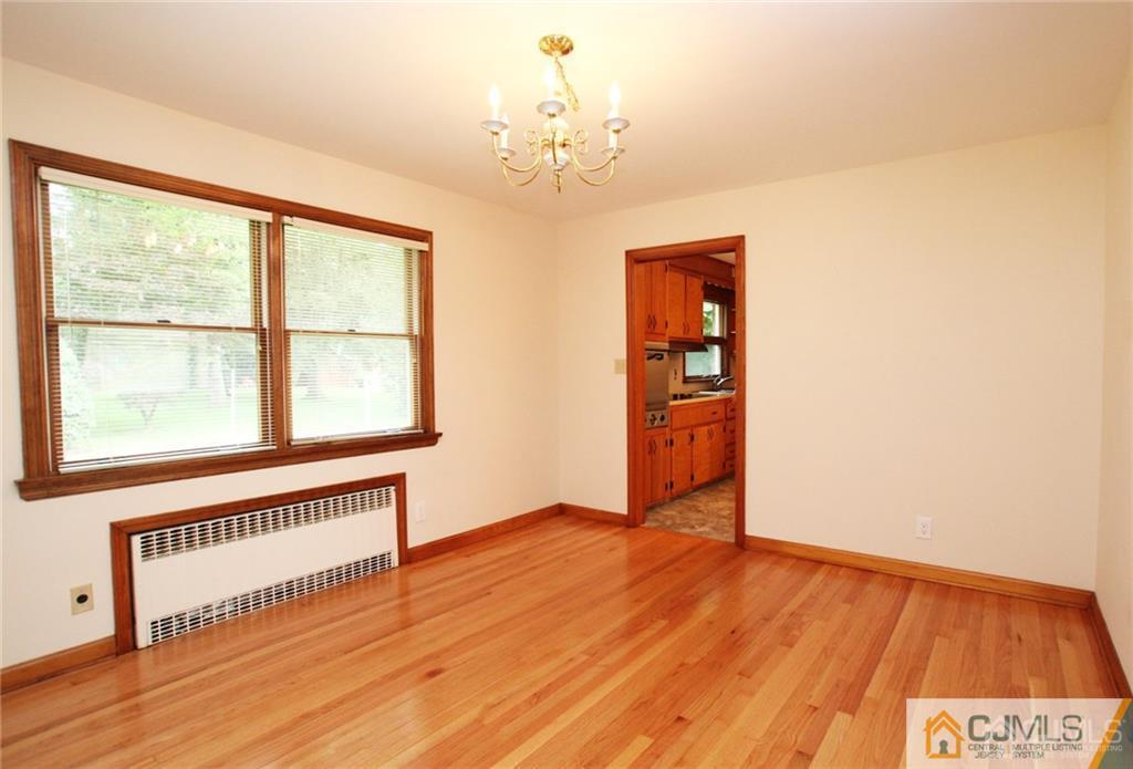 25 Academy Road Somerset, NJ 08873 - Photo 8 of 25 a view of an empty room with wooden floor and a window