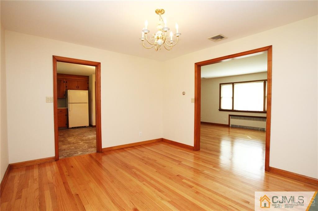 25 Academy Road Somerset, NJ 08873 - Photo 9 of 25 a view of a room with wooden floor and a window